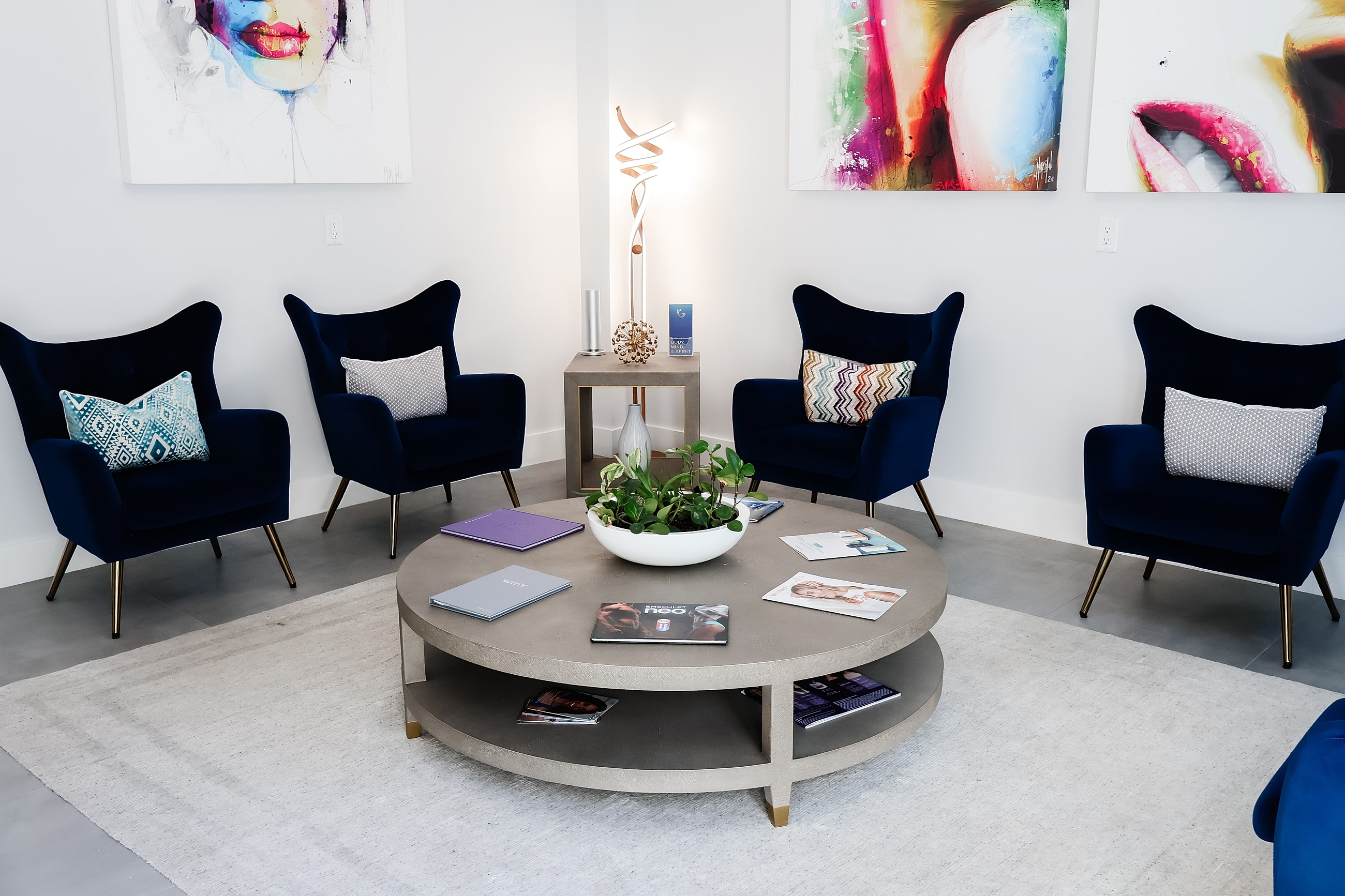 Modern lounge area with stylish chairs and decor.